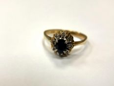 An 18ct gold sapphire and diamond cluster ring, size O.