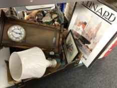 A box containing framed Cunard print, contemporary wall clock, table lamp,