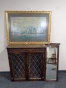 An oak leaded glass double door bookcase together with an Edwardian mahogany hall mirror and a gilt