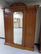 A Victorian style mahogany triple door wardrobe