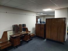 An E Gomme designed G Plan teak five piece bedroom suite comprising of triple door wardrobe,