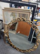 An ornate gilt circular mirror and a quantity of pictures and prints,