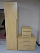 A contemporary oak effect single door wardrobe together with matching three drawer chest and two
