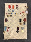 Approximately sixteen reproduction medals and badges of Russian/ Eastern European interest (16)
