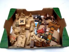 A box containing wooden tourist figures,