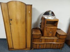 A burr walnut single door wardrobe with matching dressing table and bedside cabinet