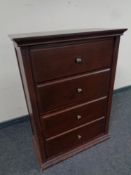 A shoe cabinet in the form of a four drawer chest