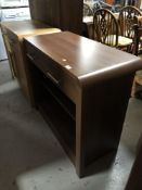 A contemporary wood effect side table fitted a drawer