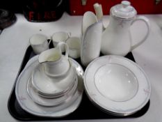 A tray containing twenty pieces of Royal Doulton Carnation bone china