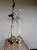 Two angle poise floor lamps together with two contemporary brass table lamps with glass shades