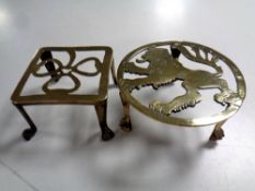 Two brass trivets