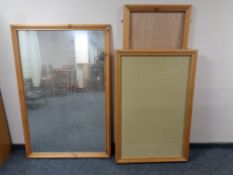 A large pine framed mirror together with two pine framed notice boards and a further pine frame