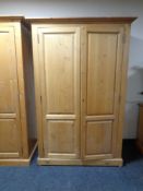 A pine double door wardrobe,