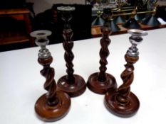 Two pairs of Edwardian barley twist candlesticks