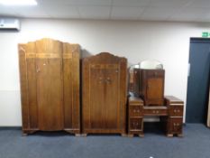A three piece walnut Art Deco bedroom suite together with similar bedside cabinet
