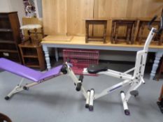 A body sculptor exerciser together with a weights bench