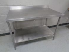 A stainless steel commercial two tier food preparation table, width 114 cm, depth 70 cm,