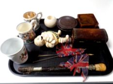 A tray of cast iron Michelin Man figure, wooden trinket box, parasol handle, Macintyre and Co.