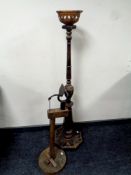 A wooden oil lamp stand together with a further wooden stand