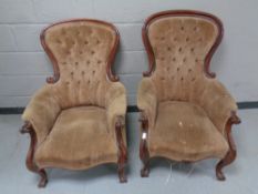 A pair of Victorian mahogany framed armchairs upholstered in a brown button dralon