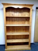A set of pine open bookshelves, width 125 cm including cornice,