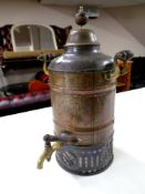 An antique copper and brass tea urn