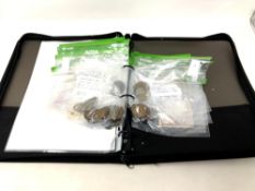 An album containing a quantity of antique and later coins, bank notes, silver three pence pieces,