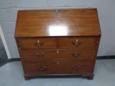 A 19th century mahogany bureau fitted four drawers on bracket feet