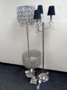 A contemporary table lamp together with two further contemporary floor lamps with glass drops