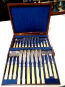 An Edwardian mahogany canteen of fish cutlery