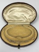 A 9ct white gold child's necklace set with pearls