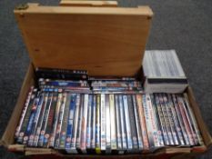 A box containing a folding artist's easel together with a large quantity of DVDs and DVD box sets