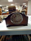 An early 20th century oak Enfield mantel clock