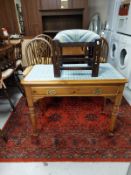 A contemporary pine single drawer side table together with a footstool