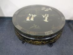 A Japanese lacquered glass topped coffee table