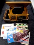 A retro style music centre together with a small quantity of vinyl LPs and seven inch singles
