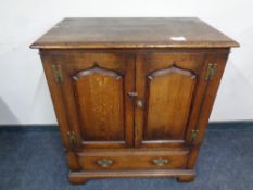 A Titchmarsh and Goodwin Georgian style cabinet fitted a drawer
