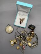 A mixed lot of costume jewellery to include necklaces, earrings, brooches, Smiths pocket watch,