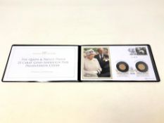 A Queen Elizabeth II and Prince Phillip Gold Sovereign Pair and Presentation Cover.