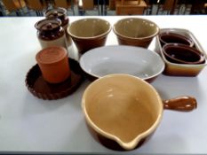 A box containing ceramic kitchenware to include flan dishes, storage jars, oven dishes,