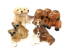 A Beswick china figure : Golden Retreivers (Seated), model 3376, golden brown, gloss, height 5 cm,