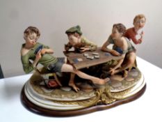 A Capodimonte figure, The Cheaters by Bruno Merli,