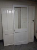 Three early 20th century painted interior doors,