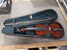 A 3/4 size violin with two piece 13