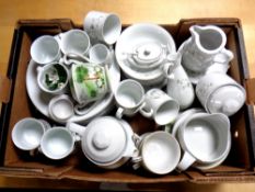 A box containing a Japanese tea service together with a further real porcelain floral patterned tea