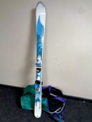 A pair of Rossisnol skies with bindings and carry bag