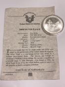 An American 2008 uncirculated silver dollar with certificate