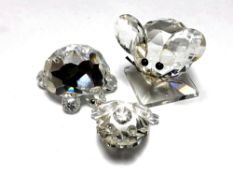Three Swarovski crystal figures, frog,