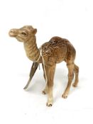 A Beswick china figure : Camel Foal, model 1043, light and dark brown, gloss, 13 cm.