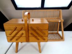A concertina sewing box and a pine wall mounted plate rack